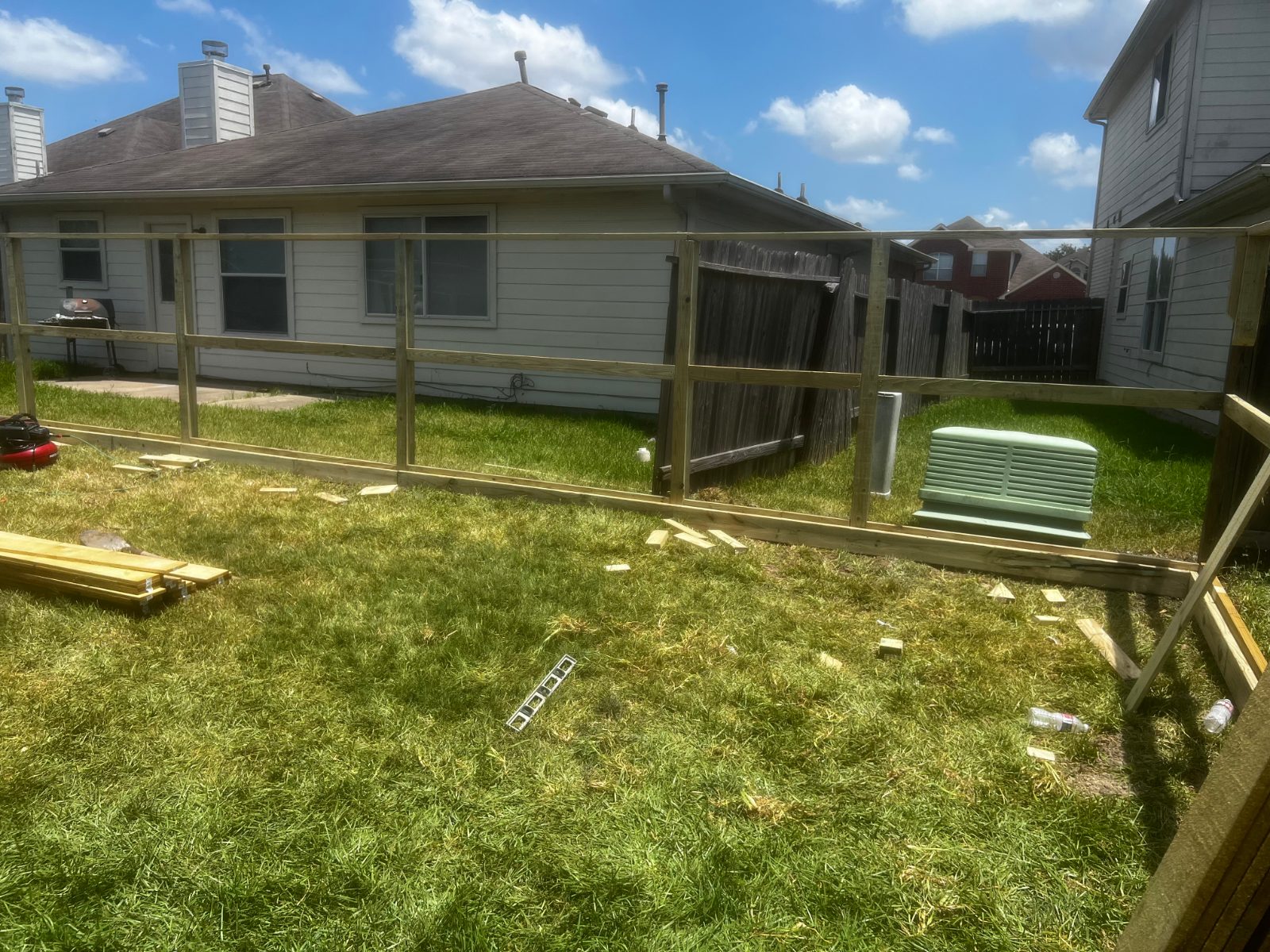 Wood fence framing in a backyard